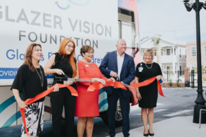 Ribbon cutting for The Mobile Vision Clinic provided by the Glazer Vision Foundation to provide eye exams to local schools